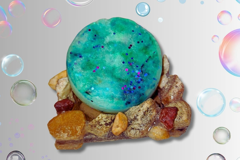 A round green hand soap placed on a stone soap dish. 